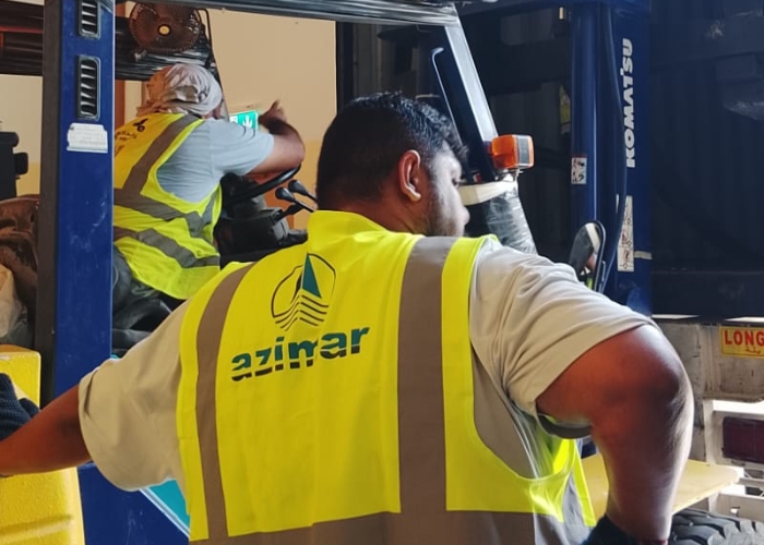 Warehouse and logistics staff coordinating project cargo planning and execution